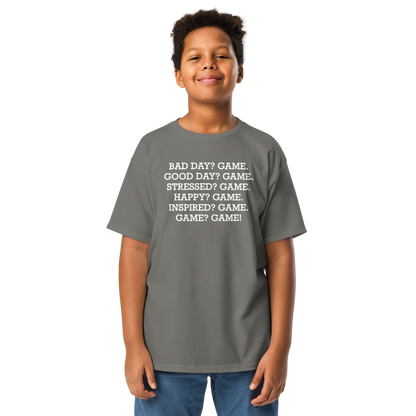 "Bad Day? Game. Good Day? Game. Stressed? Game. Happy? Game. Inspired? Game. Game? Game!" printed on a charcoal youth classic tee worn by a male