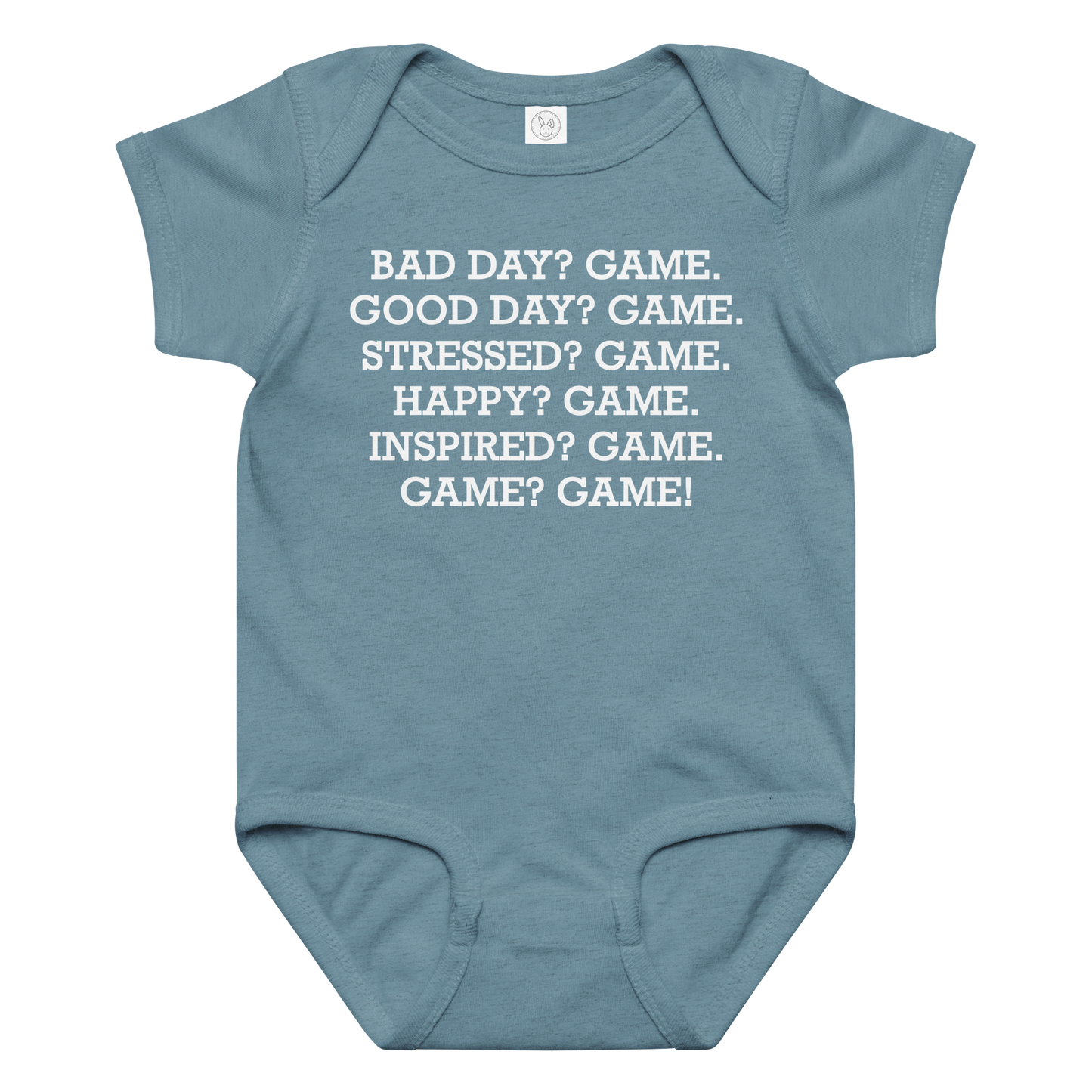 "Bad Day? Game. Good Day? Game. Stressed? Game. Happy? Game. Inspired? Game. Game? Game!" printed on a vintage indigo baby jersey bodysuit laying on a flat surface amongst other clothes
