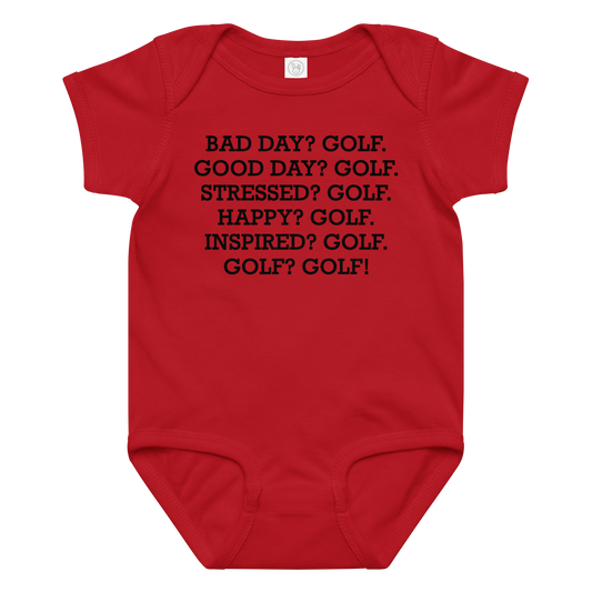 "Bad Day? Golf. Good Day? Golf. Stressed? Golf. Happy? Golf. Inspired? Golf. Golf? Golf!" printed on a red baby jersey bodysuit laying on a flat surface amongst other clothes