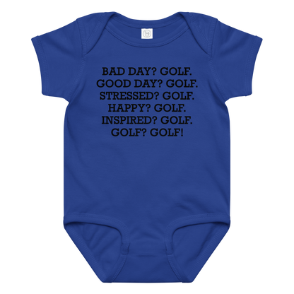 "Bad Day? Golf. Good Day? Golf. Stressed? Golf. Happy? Golf. Inspired? Golf. Golf? Golf!" printed on a royal baby jersey bodysuit laying on a flat surface amongst other clothes