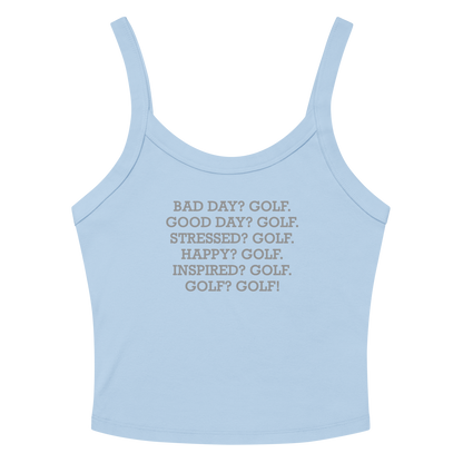 "Bad Day? Golf. Good Day? Golf. Stressed? Golf. Happy? Golf. Inspired? Golf. Golf? Golf!" printed on a solid baby blue blend women's micro-rib tanktop laying on a flat surface amongst sunglasses and shorts