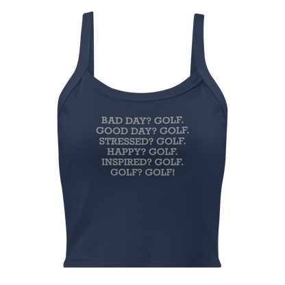 "Bad Day? Golf. Good Day? Golf. Stressed? Golf. Happy? Golf. Inspired? Golf. Golf? Golf!" printed on a solid navy blend women's micro-rib tanktop laying on a flat surface