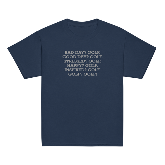 "Bad Day? Golf. Good Day? Golf. Stressed? Golf. Happy? Golf. Inspired? Golf. Golf? Golf!" printed on a navy youth classic tee laying on a flat surface