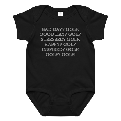 "Bad Day? Golf. Good Day? Golf. Stressed? Golf. Happy? Golf. Inspired? Golf. Golf? Golf!" printed on a black baby jersey bodysuit laying on a flat surface amongst other clothes