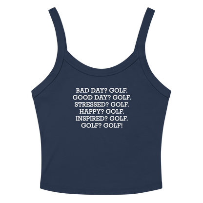 "Bad Day? Golf. Good Day? Golf. Stressed? Golf. Happy? Golf. Inspired? Golf. Golf? Golf!" printed on a solid navy blend women's micro-rib tanktop laying on a flat surface amongst sunglasses and shorts