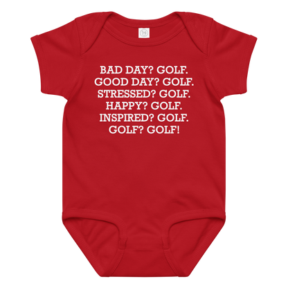 "Bad Day? Golf. Good Day? Golf. Stressed? Golf. Happy? Golf. Inspired? Golf. Golf? Golf!" printed on a red baby jersey bodysuit laying on a flat surface amongst other clothes