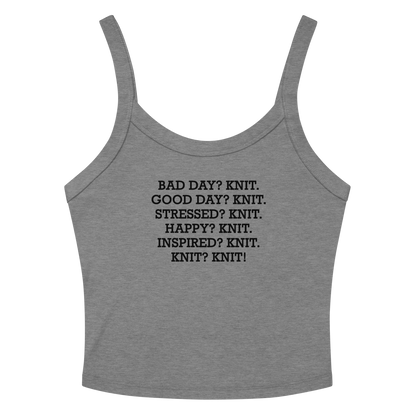 "Bad Day? Knit. Good Day? Knit. Stressed? Knit. Happy? Knit. Inspired? Knit. Knit? Knit!" printed on a athletic heather women's micro-rib tanktop laying on a flat surface amongst sunglasses and shorts
