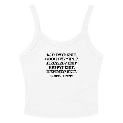 "Bad Day? Knit. Good Day? Knit. Stressed? Knit. Happy? Knit. Inspired? Knit. Knit? Knit!" printed on a solid white blend women's micro-rib tanktop laying on a flat surface amongst sunglasses and shorts