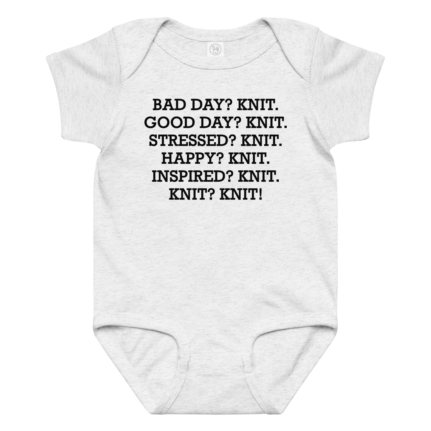 "Bad Day? Knit. Good Day? Knit. Stressed? Knit. Happy? Knit. Inspired? Knit. Knit? Knit!" printed on a ash baby jersey bodysuit laying on a flat surface amongst other clothes