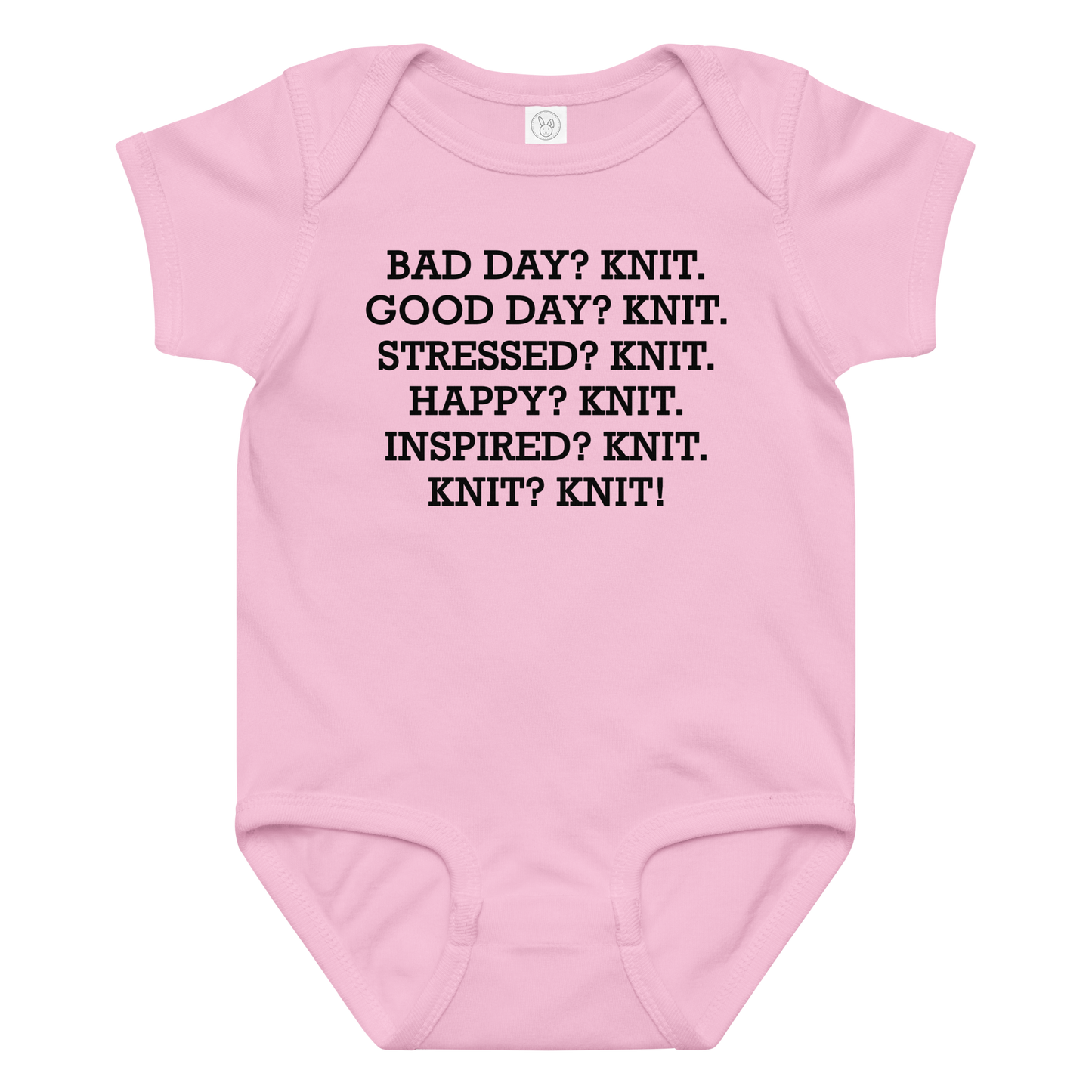 "Bad Day? Knit. Good Day? Knit. Stressed? Knit. Happy? Knit. Inspired? Knit. Knit? Knit!" printed on a pink baby jersey bodysuit laying on a flat surface amongst other clothes