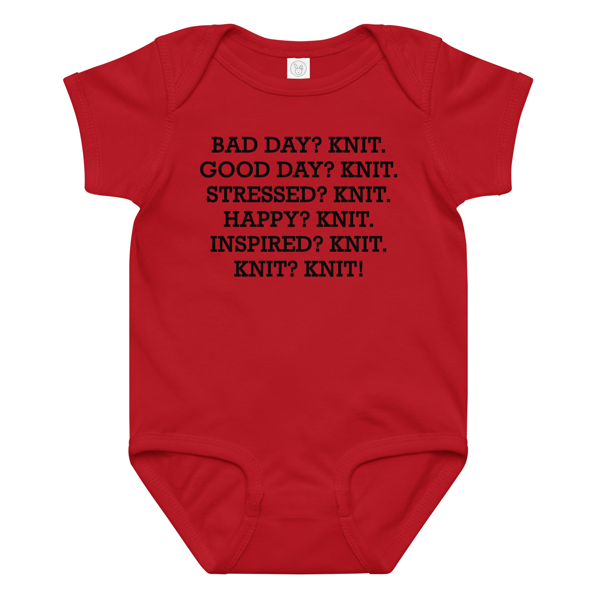"Bad Day? Knit. Good Day? Knit. Stressed? Knit. Happy? Knit. Inspired? Knit. Knit? Knit!" printed on a red baby jersey bodysuit laying on a flat surface amongst other clothes