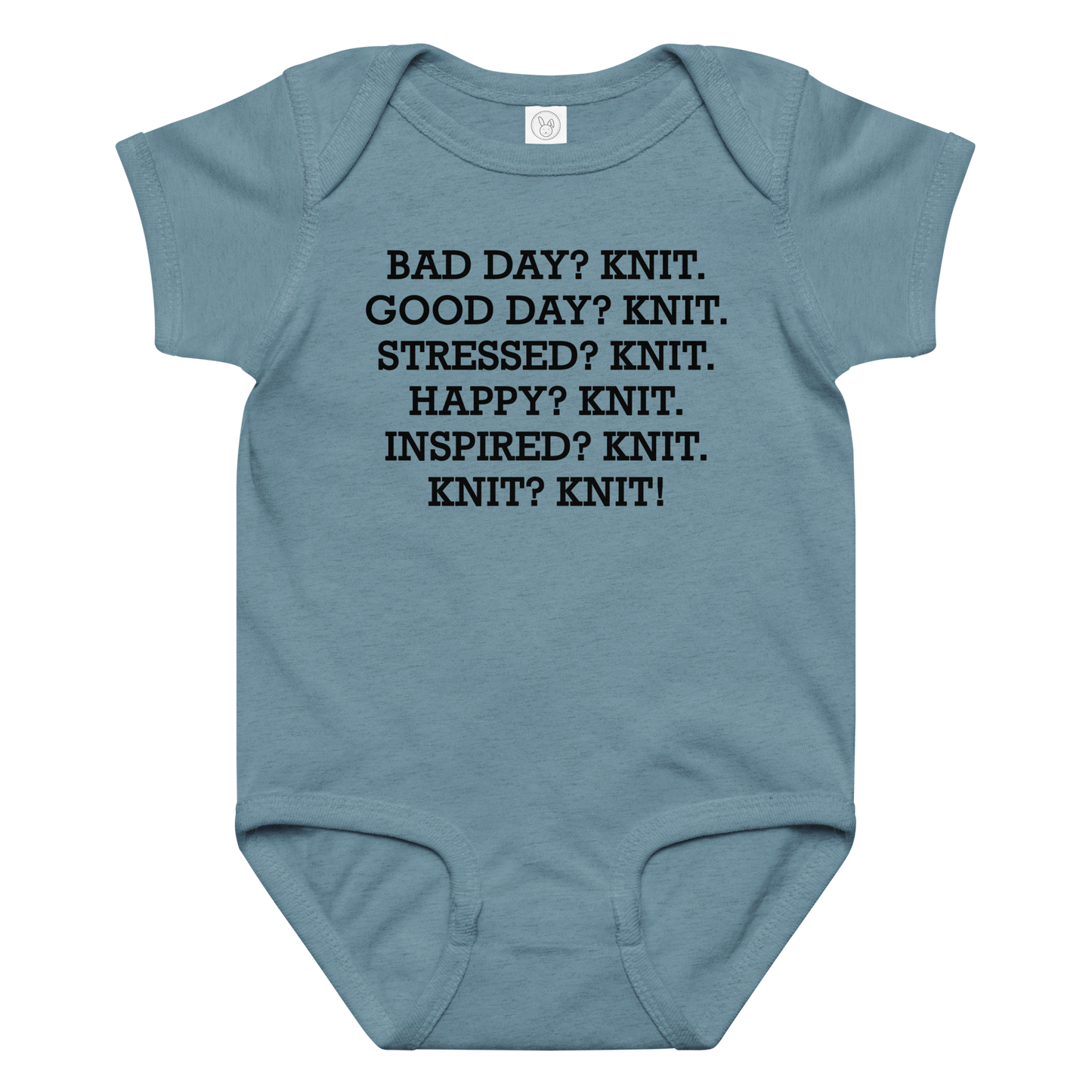 "Bad Day? Knit. Good Day? Knit. Stressed? Knit. Happy? Knit. Inspired? Knit. Knit? Knit!" printed on a vintage indigo baby jersey bodysuit laying on a flat surface amongst other clothes