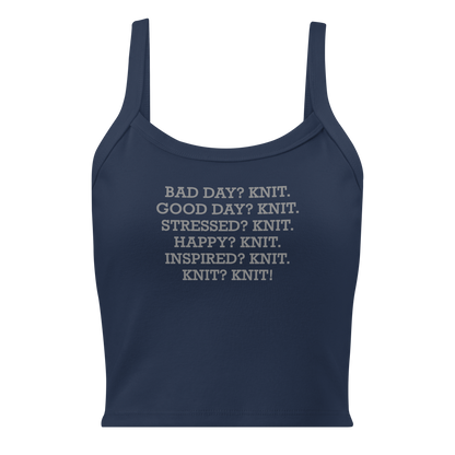 "Bad Day? Knit. Good Day? Knit. Stressed? Knit. Happy? Knit. Inspired? Knit. Knit? Knit!" printed on a solid navy blend women's micro-rib tanktop laying on a flat surface