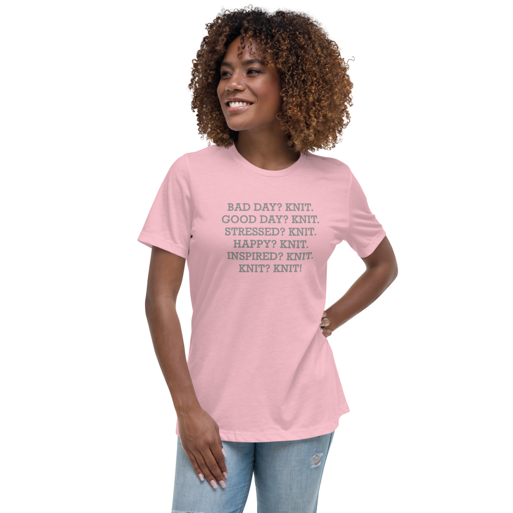 "Bad Day? Knit. Good Day? Knit. Stressed? Knit. Happy? Knit. Inspired? Knit. Knit? Knit!" printed on a pink women's relaxed t-shirt worn by a female