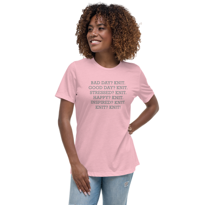 "Bad Day? Knit. Good Day? Knit. Stressed? Knit. Happy? Knit. Inspired? Knit. Knit? Knit!" printed on a pink women's relaxed t-shirt worn by a female