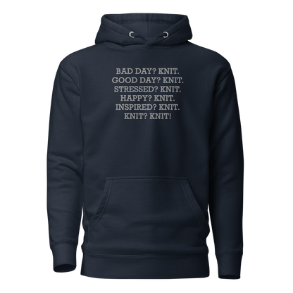 "Bad Day? Knit. Good Day? Knit. Stressed? Knit. Happy? Knit. Inspired? Knit. Knit? Knit!" printed on a navy blazer on an invisible / simulated body