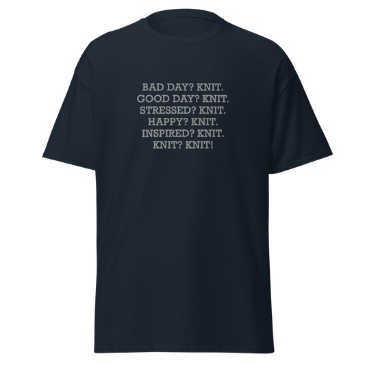 "Bad Day? Knit. Good Day? Knit. Stressed? Knit. Happy? Knit. Inspired? Knit. Knit? Knit!" printed on a navy unisex classic tee laying on a flat surface