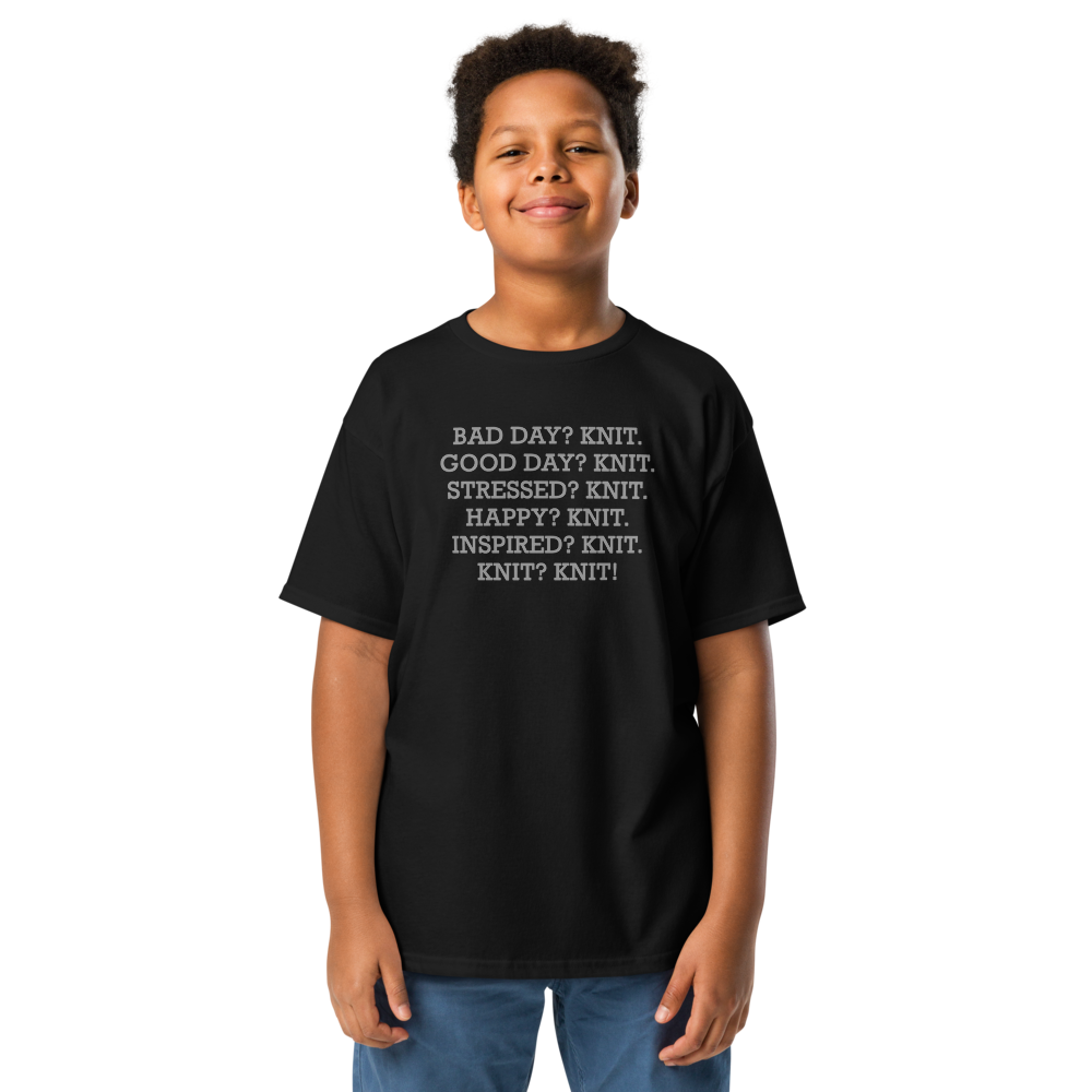 "Bad Day? Knit. Good Day? Knit. Stressed? Knit. Happy? Knit. Inspired? Knit. Knit? Knit!" printed on a black youth classic tee worn by a male