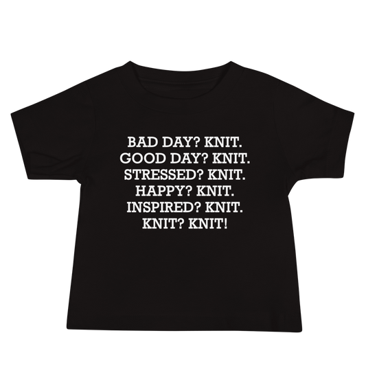 "Bad Day? Knit. Good Day? Knit. Stressed? Knit. Happy? Knit. Inspired? Knit. Knit? Knit!" printed on a black baby jersey short sleeve tee laying on a flat surface