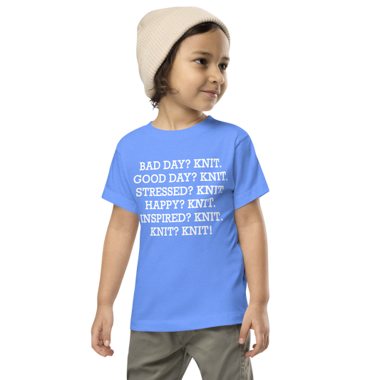 "Bad Day? Knit. Good Day? Knit. Stressed? Knit. Happy? Knit. Inspired? Knit. Knit? Knit!" printed on a heather columbia blue toddler short sleeve tee worn by a male wearing a cap