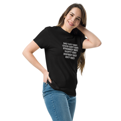 "Bad Day? Knit. Good Day? Knit. Stressed? Knit. Happy? Knit. Inspired? Knit. Knit? Knit!" printed on a black unisex classic tee worn by a female