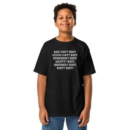 "Bad Day? Knit. Good Day? Knit. Stressed? Knit. Happy? Knit. Inspired? Knit. Knit? Knit!" printed on a black youth classic tee worn by a male