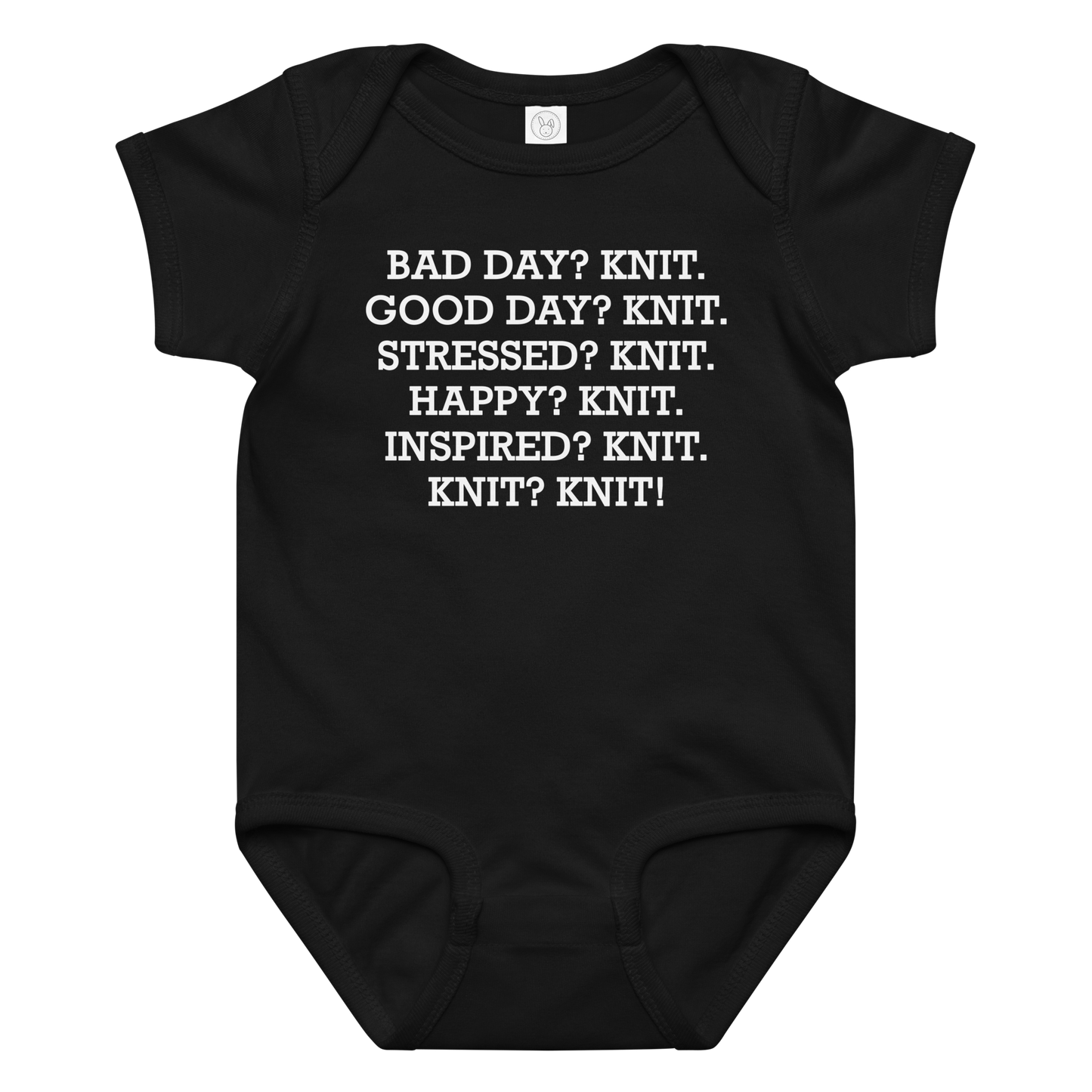 "Bad Day? Knit. Good Day? Knit. Stressed? Knit. Happy? Knit. Inspired? Knit. Knit? Knit!" printed on a black baby jersey bodysuit laying on a flat surface amongst other clothes