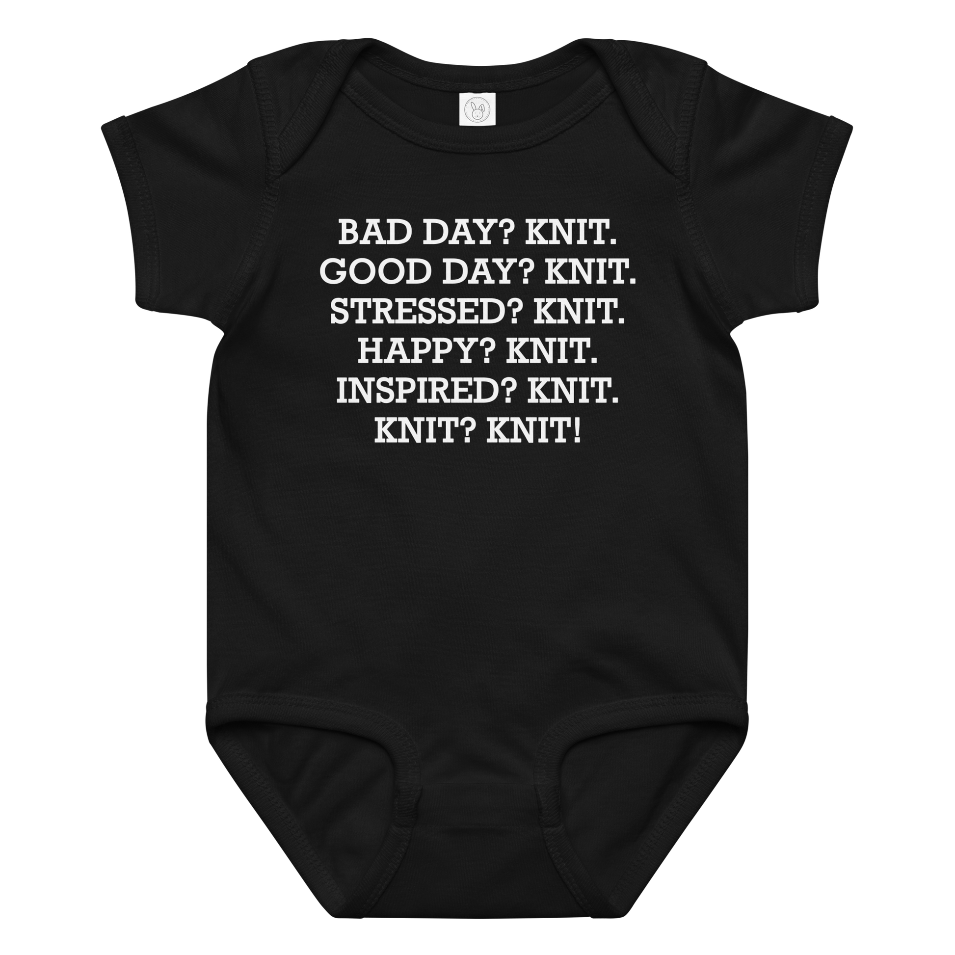 "Bad Day? Knit. Good Day? Knit. Stressed? Knit. Happy? Knit. Inspired? Knit. Knit? Knit!" printed on a black baby jersey bodysuit laying on a flat surface amongst other clothes
