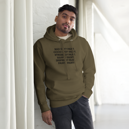 "Bad Day? Paint. Good Day? Paint. Stressed? Paint. Happy? Paint. Inspired? Paint. Paint? Paint!" printed on a military green unisex hoodie worn by a male