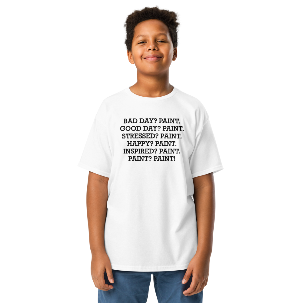 "Bad Day? Paint. Good Day? Paint. Stressed? Paint. Happy? Paint. Inspired? Paint. Paint? Paint!" printed on a white youth classic tee worn by a male
