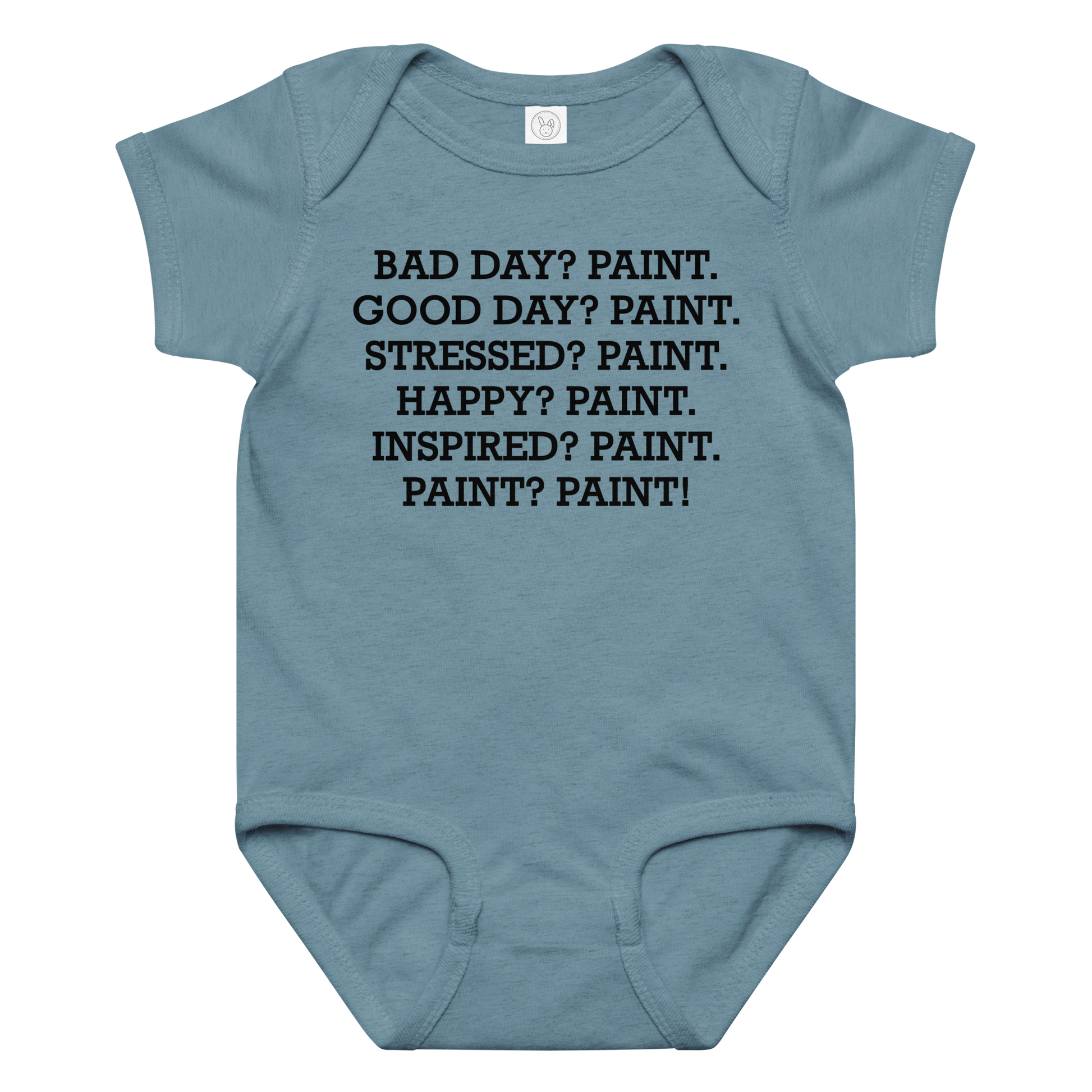 "Bad Day? Paint. Good Day? Paint. Stressed? Paint. Happy? Paint. Inspired? Paint. Paint? Paint!" printed on a vintage indigo baby jersey bodysuit laying on a flat surface amongst other clothes