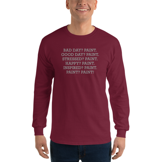 "Bad Day? Paint. Good Day? Paint. Stressed? Paint. Happy? Paint. Inspired? Paint. Paint? Paint!" printed on a maroon men's long sleeve shirt worn by a male