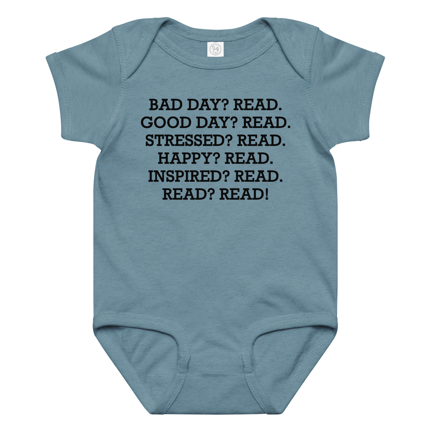 "Bad Day? Read. Good Day? Read. Stressed? Read. Happy? Read. Inspired? Read. Read? Read!" printed on a vintage indigo baby jersey bodysuit laying on a flat surface amongst other clothes