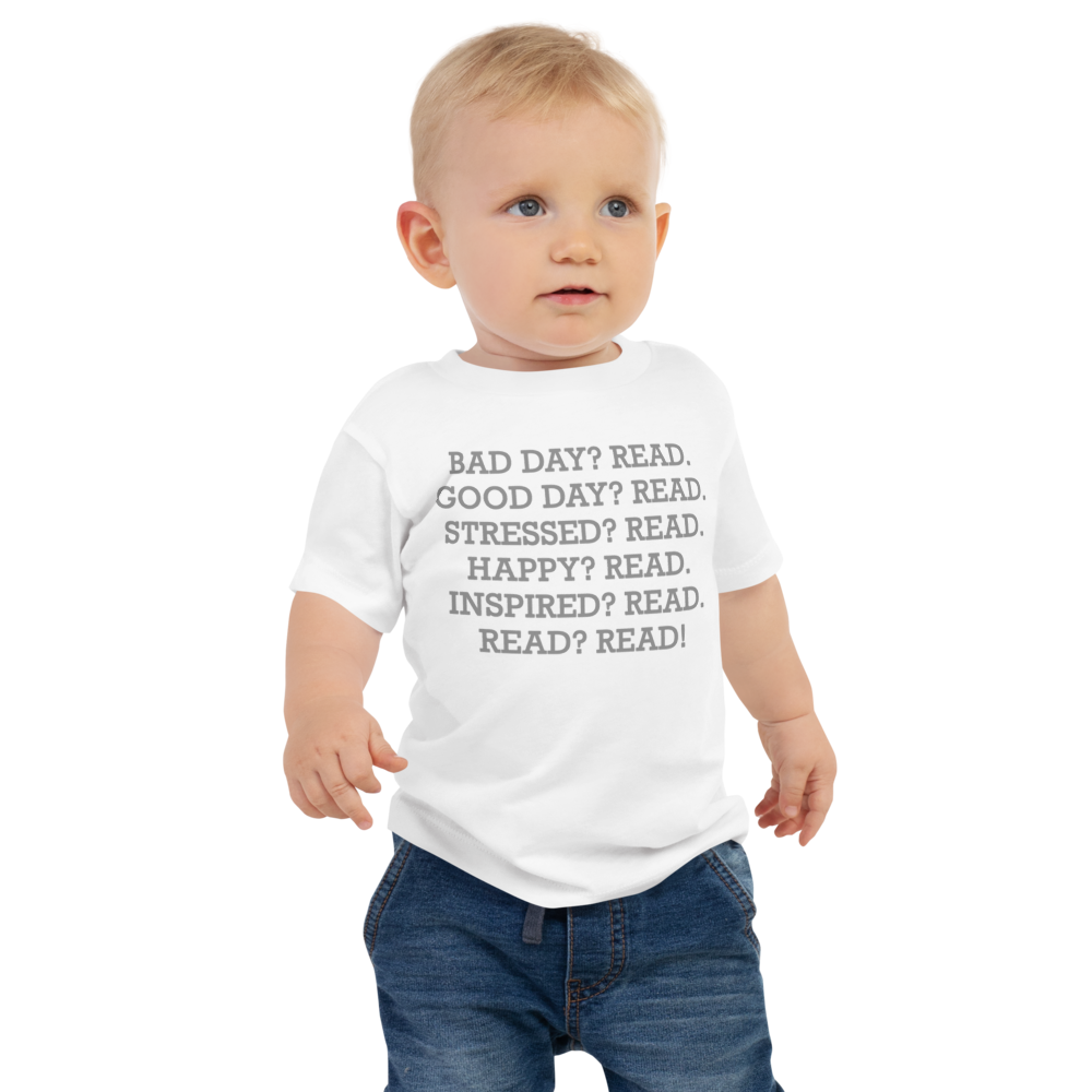 "Bad Day? Read. Good Day? Read. Stressed? Read. Happy? Read. Inspired? Read. Read? Read!" printed on a white baby jersey short sleeve tee worn by a male