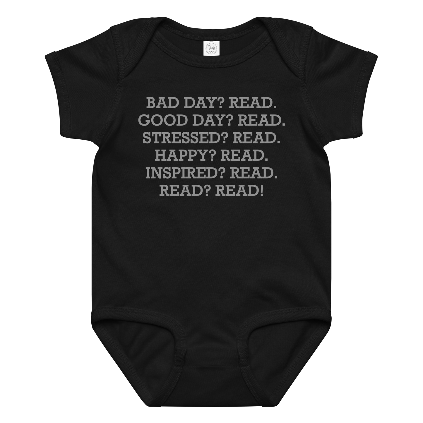 "Bad Day? Read. Good Day? Read. Stressed? Read. Happy? Read. Inspired? Read. Read? Read!" printed on a black baby jersey bodysuit laying on a flat surface amongst other clothes
