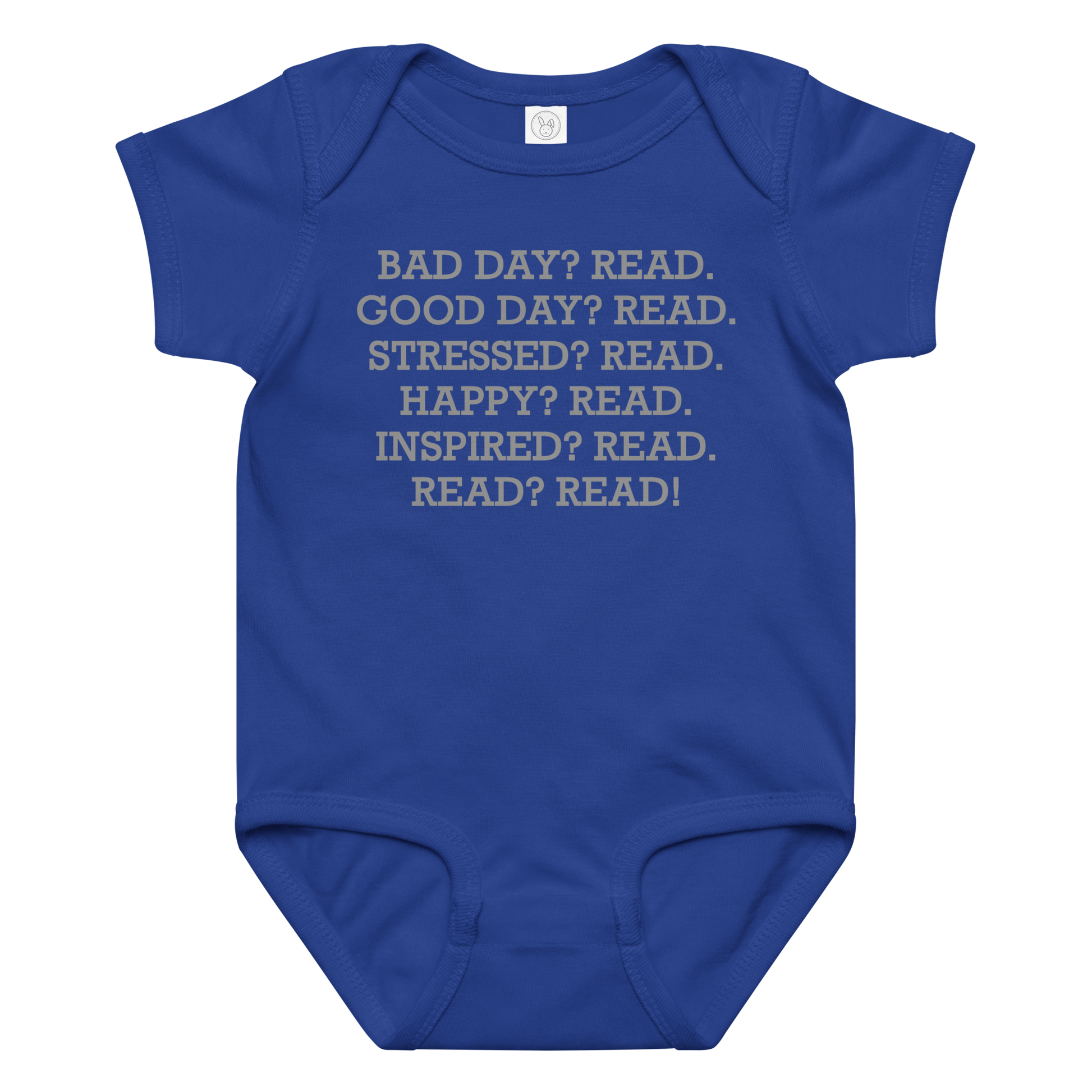 "Bad Day? Read. Good Day? Read. Stressed? Read. Happy? Read. Inspired? Read. Read? Read!" printed on a royal baby jersey bodysuit laying on a flat surface amongst other clothes