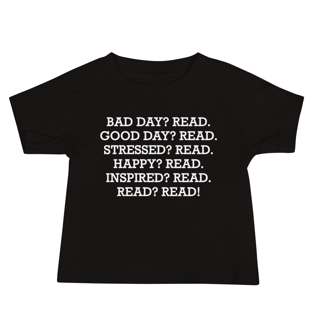 "Bad Day? Read. Good Day? Read. Stressed? Read. Happy? Read. Inspired? Read. Read? Read!" printed on a black baby jersey short sleeve tee laying on a flat surface