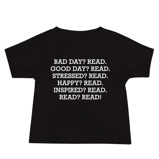 "Bad Day? Read. Good Day? Read. Stressed? Read. Happy? Read. Inspired? Read. Read? Read!" printed on a black baby jersey short sleeve tee laying on a flat surface