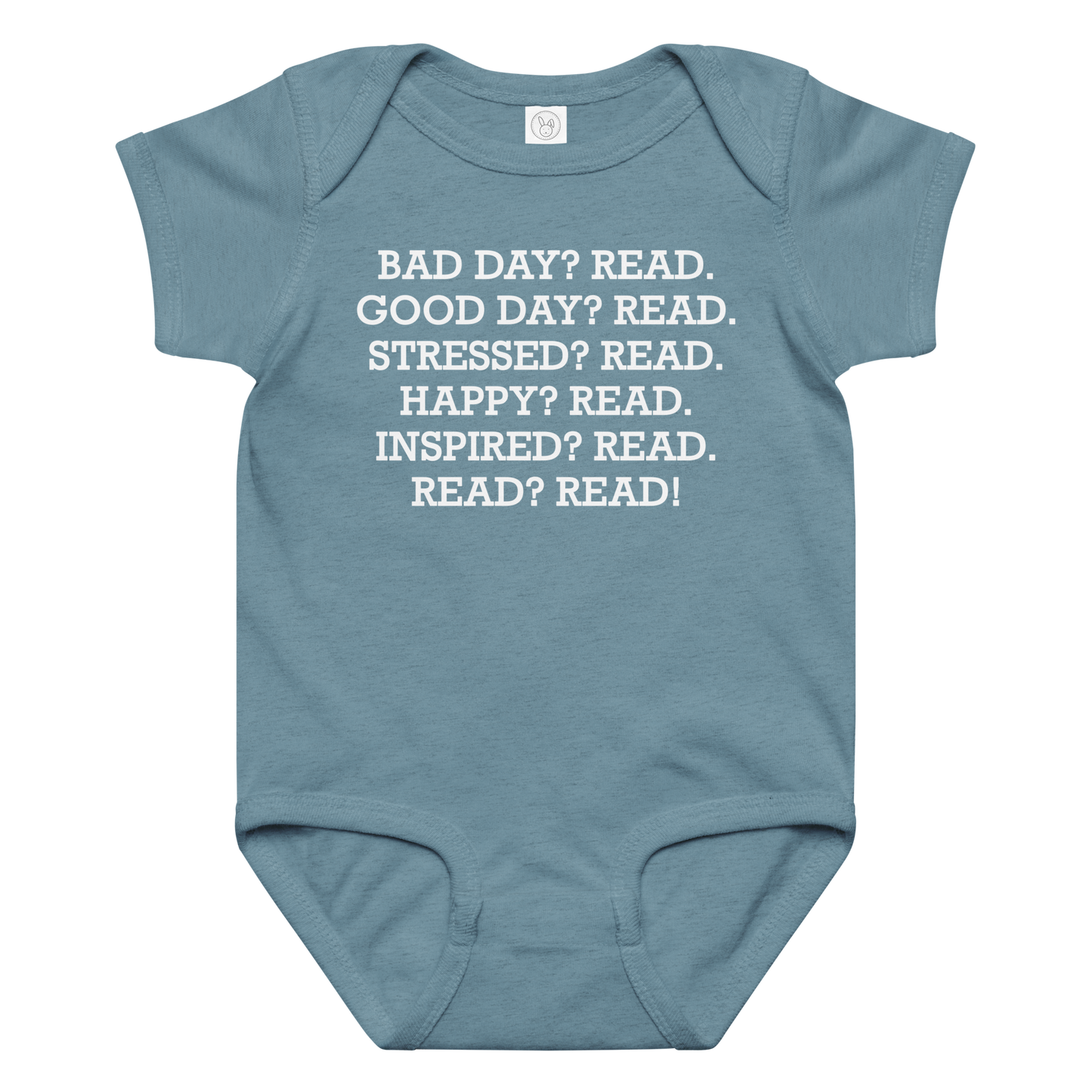 "Bad Day? Read. Good Day? Read. Stressed? Read. Happy? Read. Inspired? Read. Read? Read!" printed on a vintage indigo baby jersey bodysuit laying on a flat surface amongst other clothes