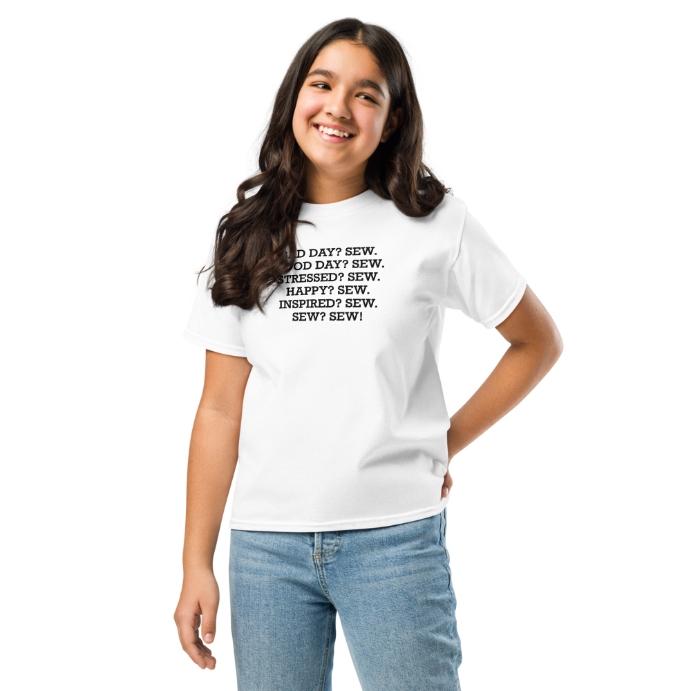"Bad Day? Sew. Good Day? Sew. Stressed? Sew. Happy? Sew. Inspired? Sew. Sew? Sew!" printed on a white youth classic tee worn by a female