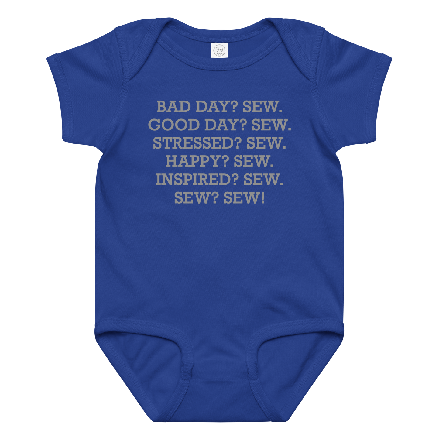 "Bad Day? Sew. Good Day? Sew. Stressed? Sew. Happy? Sew. Inspired? Sew. Sew? Sew!" printed on a royal baby jersey bodysuit laying on a flat surface amongst other clothes
