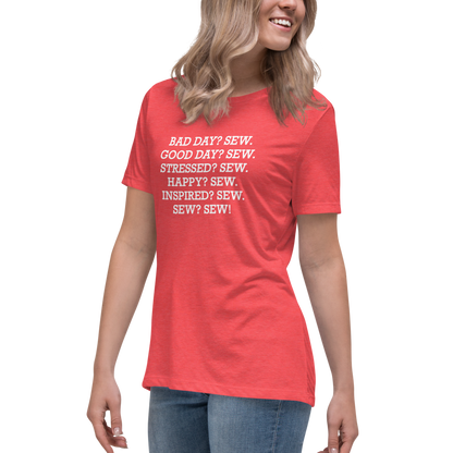 "Bad Day? Sew. Good Day? Sew. Stressed? Sew. Happy? Sew. Inspired? Sew. Sew? Sew!" printed on a heather red women's relaxed t-shirt worn by a female
