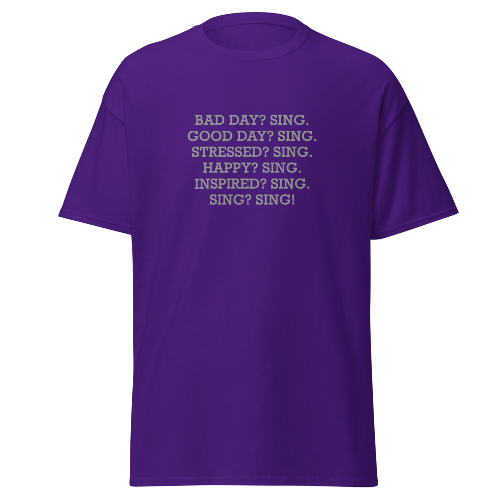 "Bad Day? Sing. Good Day? Sing. Stressed? Sing. Happy? Sing. Inspired? Sing. Sing? Sing!" printed on a purple on an invisible body