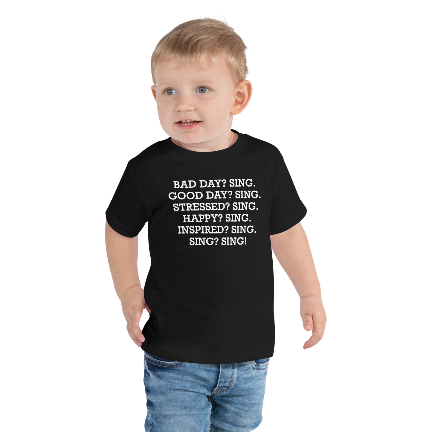 "Bad Day? Sing. Good Day? Sing. Stressed? Sing. Happy? Sing. Inspired? Sing. Sing? Sing!" printed on a black toddler short sleeve tee worn by a male