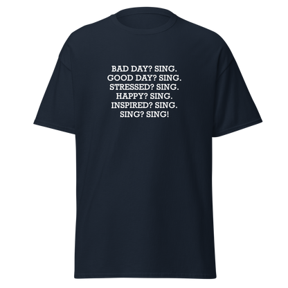 "Bad Day? Sing. Good Day? Sing. Stressed? Sing. Happy? Sing. Inspired? Sing. Sing? Sing!" printed on a navy on an invisible body
