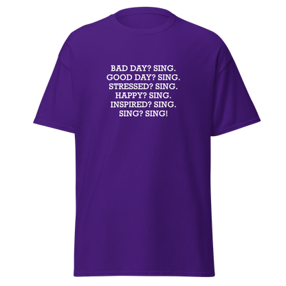 "Bad Day? Sing. Good Day? Sing. Stressed? Sing. Happy? Sing. Inspired? Sing. Sing? Sing!" printed on a purple on an invisible body