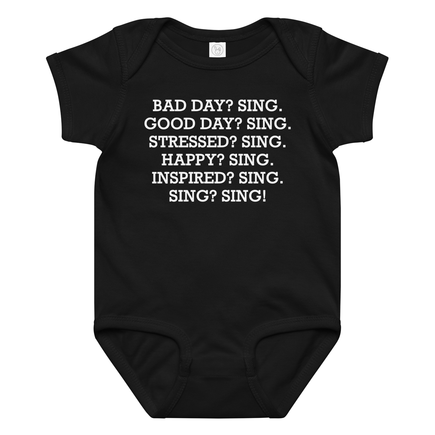 "Bad Day? Sing. Good Day? Sing. Stressed? Sing. Happy? Sing. Inspired? Sing. Sing? Sing!" printed on a black baby jersey bodysuit laying on a flat surface amongst other clothes