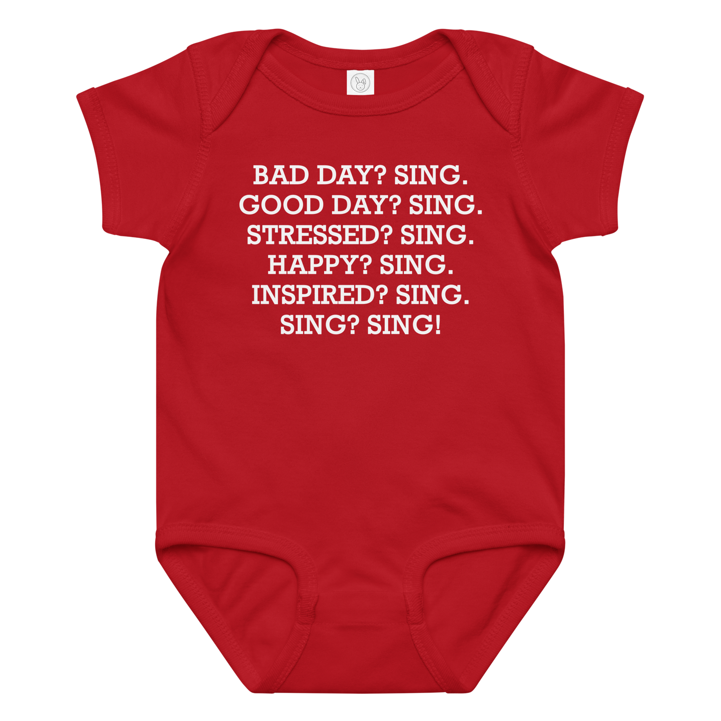 "Bad Day? Sing. Good Day? Sing. Stressed? Sing. Happy? Sing. Inspired? Sing. Sing? Sing!" printed on a red baby jersey bodysuit laying on a flat surface amongst other clothes