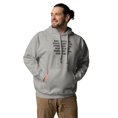 "Bad Day? Surf. Good Day? Surf. Stressed? Surf. Happy? Surf. Inspired? Surf. Surf? Surf!" printed on a carbon grey unisex hoodie worn by a male