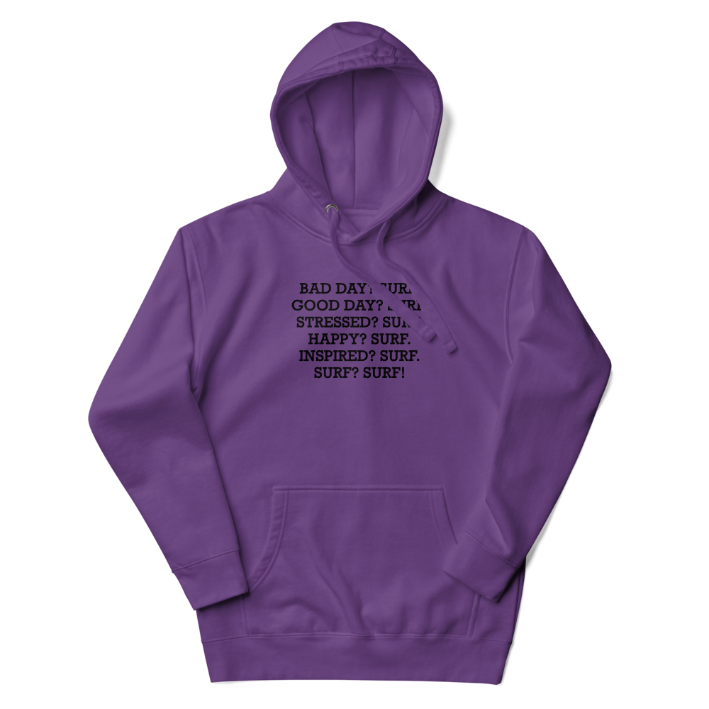 "Bad Day? Surf. Good Day? Surf. Stressed? Surf. Happy? Surf. Inspired? Surf. Surf? Surf!" printed on a purple unisex hoodie laying on a flat surface with the hood up